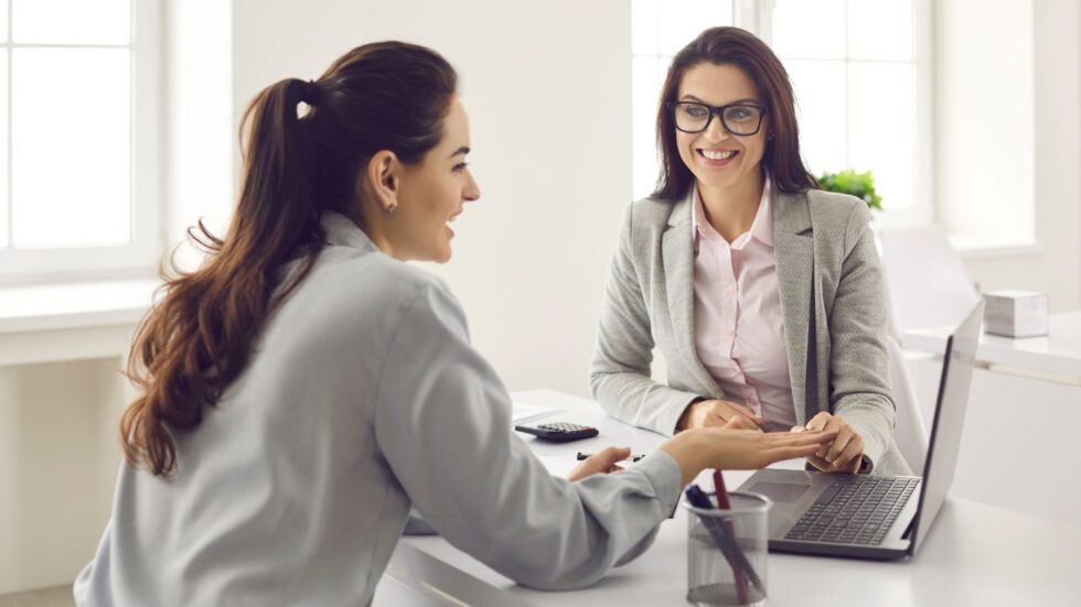 Two Women Discussing About Workers’ Comp Claim